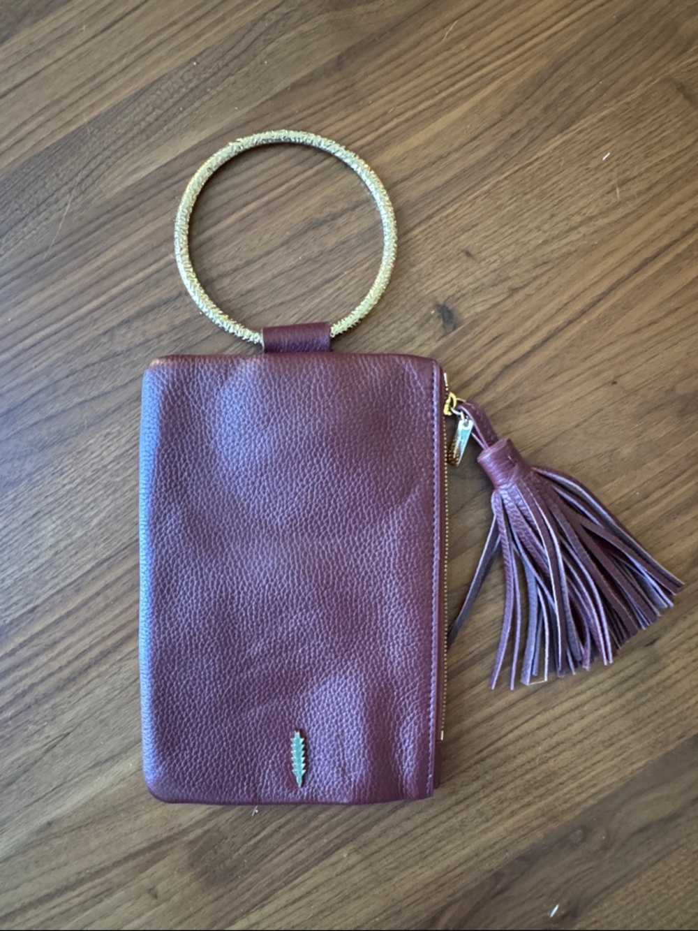 Thacker Burgundy Leather Wristlet Clutch with Gold Bracelet Handle and Tassel